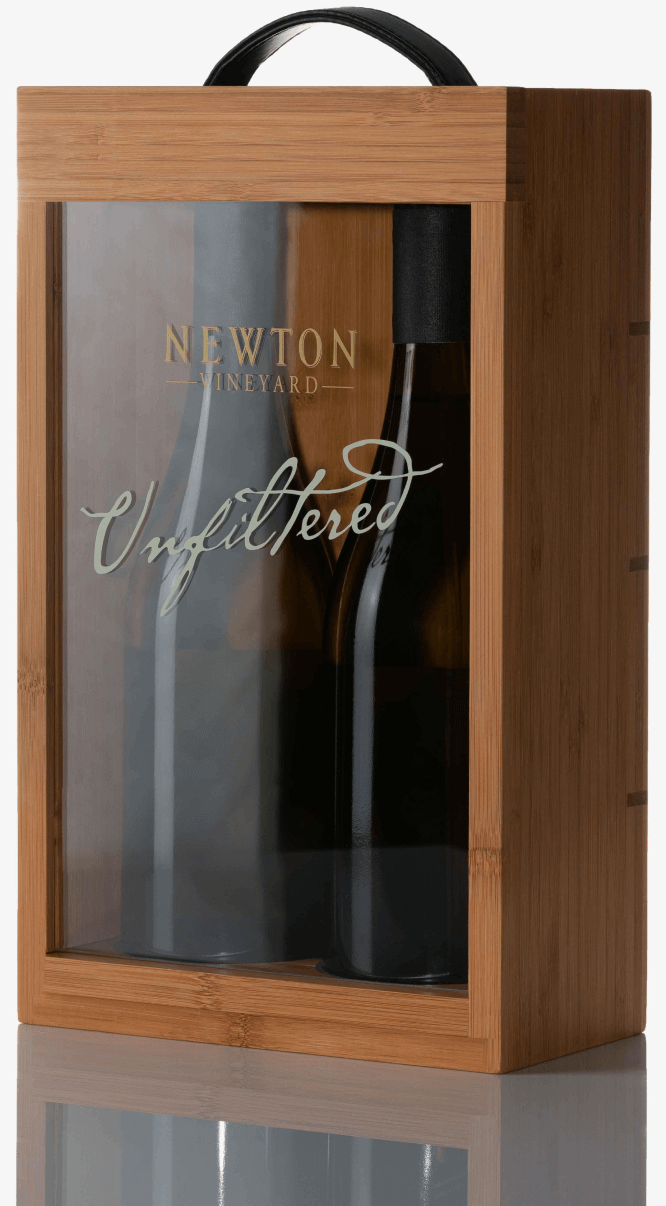 Two bottles of wine in a wooden box.
