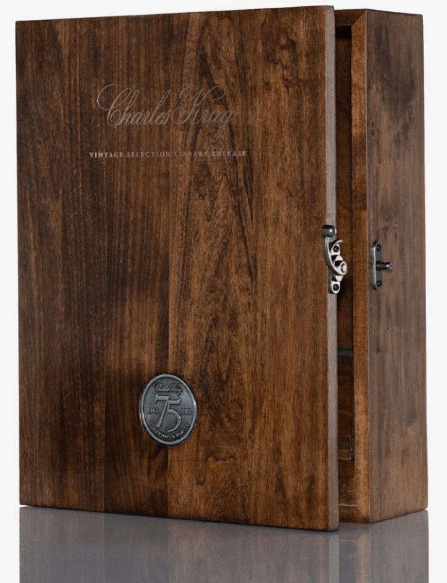 A wooden box with a medallion on it.